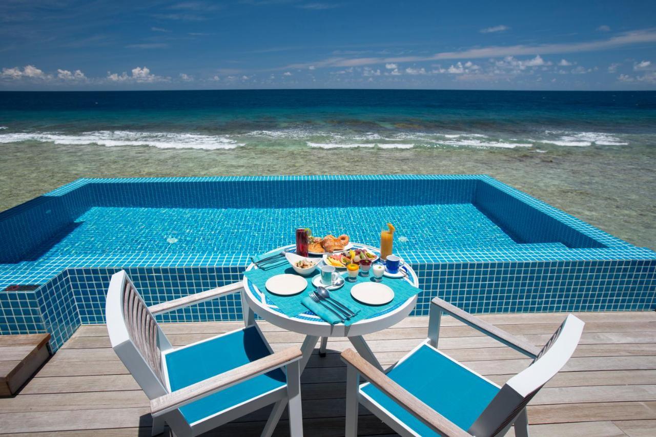Kandima Maldives Kudahuvadhoo Exteriör bild A pool at a resort in Maldives